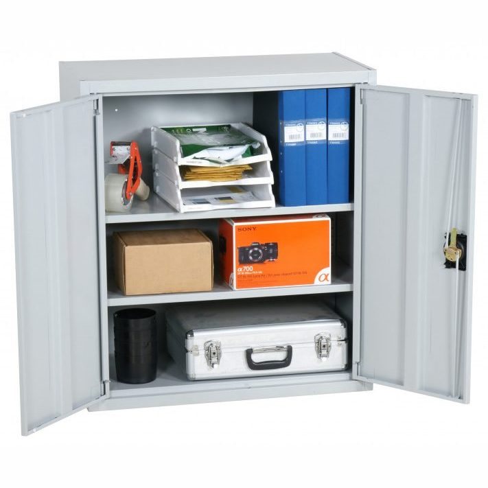 Grey metal storage cabinet with two open doors showing three shelves with office supplies and boxes.