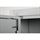 Close-up of a grey metal hinge with a spring-loaded pin on a cabinet with the door slightly ajar.