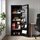 Tall black cabinet with open door, filled with personal belongings on shelves and in the door, in an office environment.