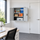 Grey wall-mounted storage cabinet with open doors and shelves filled with office supplies, in an office environment.